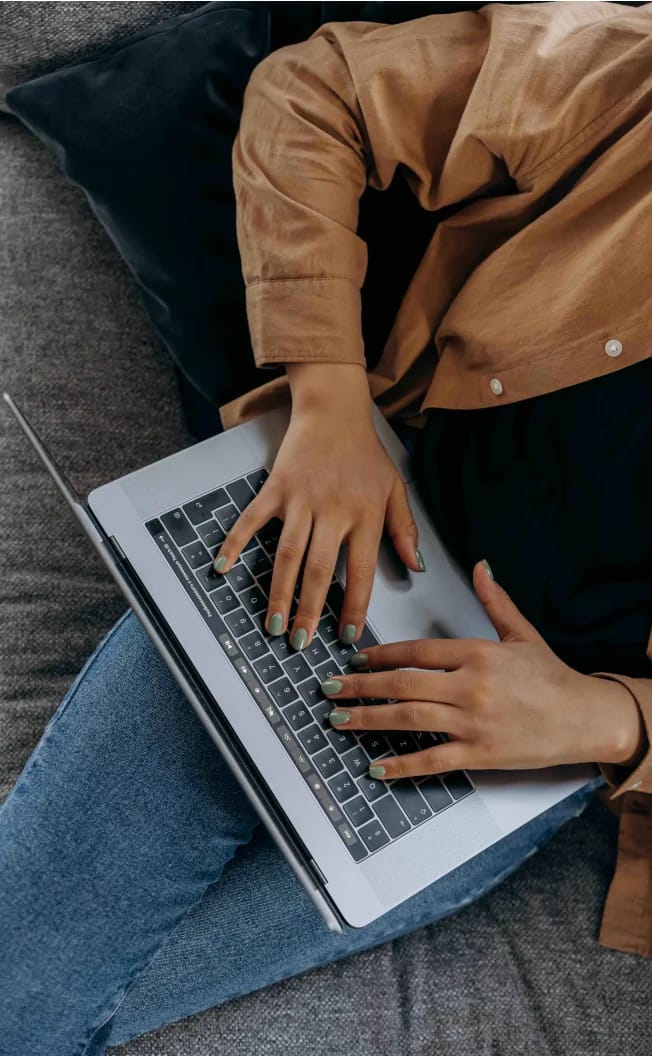 Person working on a laptop with the Notion app open.